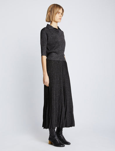 Side full length image of model wearing Metallic Knit Polo in BLACK