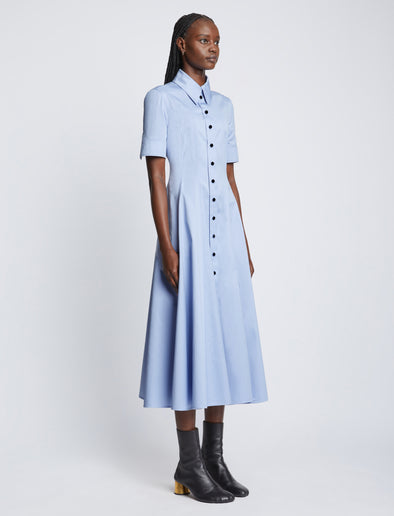Side full length image of model wearing Silk Cotton Short Sleeve Button Dress in PERIWINKLE