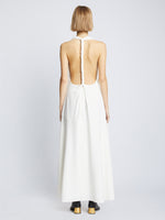 Back full length image of model wearing Matte Crepe Twist Back V-Neck Dress in WHITE