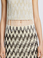 Detail image of model wearing Graphic Beaded Fringe Embroidered Top in WHITE MULTI