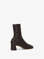 Back 3/4 image of GLOVE STRETCH ANKLE BOOTS in Black
