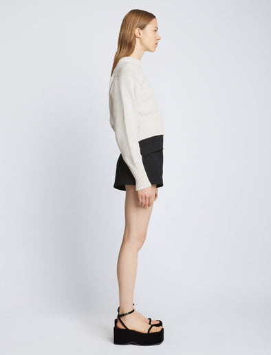 Side full length image of model wearing Textured Cotton Sweater in IVORY