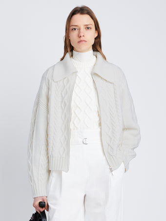 Front cropped image of model wearing Relaxed Chunky Cable Zip Sweater in OFF WHITE
