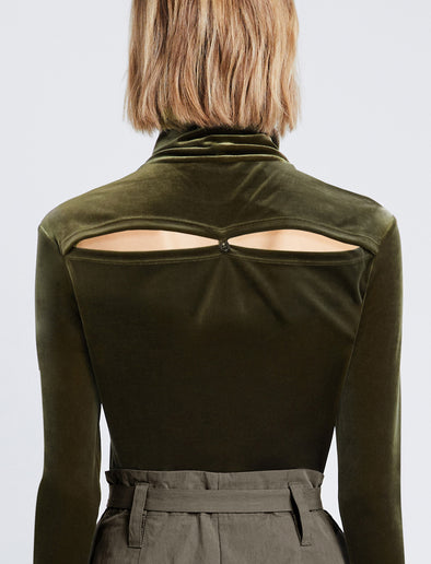 Detail image of model wearing Stretch Velvet Turtleneck Top in MILITARY buttoned