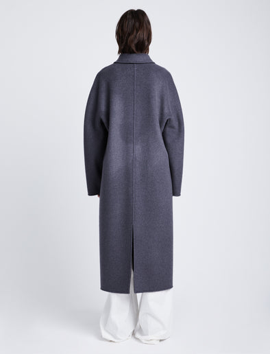 Back full length image of model wearing Reversible Double Face Coat in BLACK / STEEL GREY on STEEL GREY side