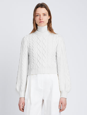 Front cropped image of model wearing Chunky Cable Bell Sleeve Sweater in OFF WHITE