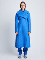 Front image of model wearing Double Face Llama Wool Coat in AZURE with buttons clasped