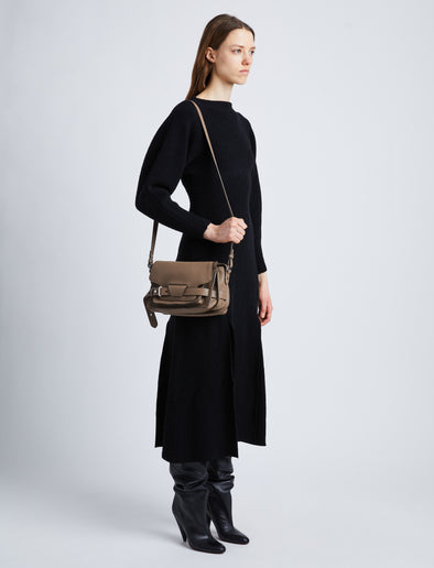 Image of model wearing Beacon Saddle Bag in MUSHROOM