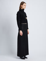 Side full length image of model wearing Wool Felt Skirt in BLACK