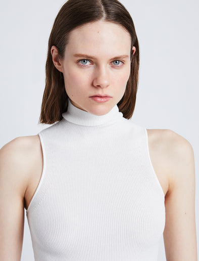 Detail image of model wearing Matte Viscose Knit Top in WHITE