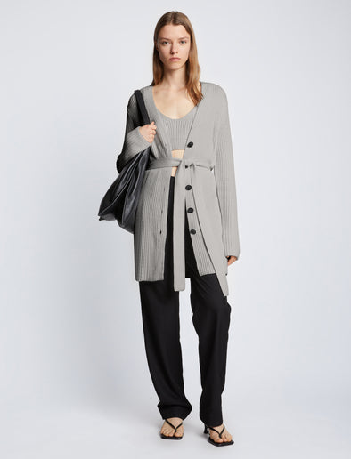 Front full length image of model wearing Ribbed Cotton Relaxed Cardigan in GREY MELANGE with belt tied in front
