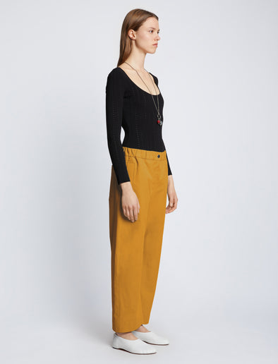 Side full length image of model wearing Solid Cotton Linen Easy Pants in GOLD