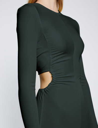 Detail image of model wearing Long Sleeve Jersey Open Back Dress in PINE