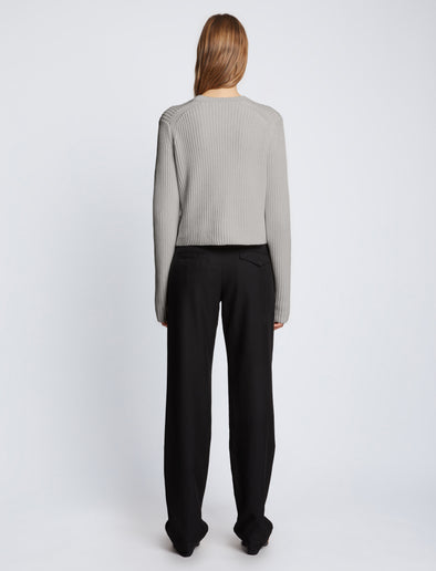 Back full length image of model wearing Ribbed Cotton Wrap Sweater in GREY MELANGE
