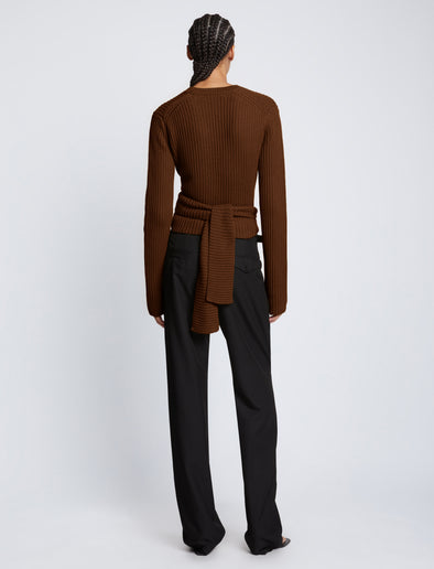 Back full length image of model wearing Ribbed Cotton Wrap Sweater in ESPRESSO