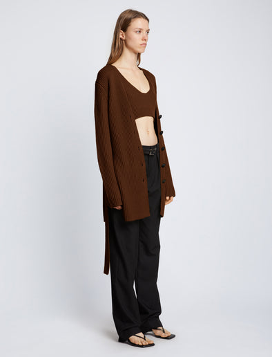 Side full length image of model wearing Ribbed Cotton Relaxed Cardigan in ESPRESSO