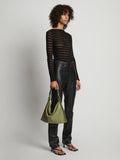 Image of model wearing Minetta Bag In Suede in bamboo