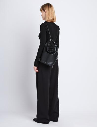 Image of model wearing image of Spring Bag In Leather in black as sling