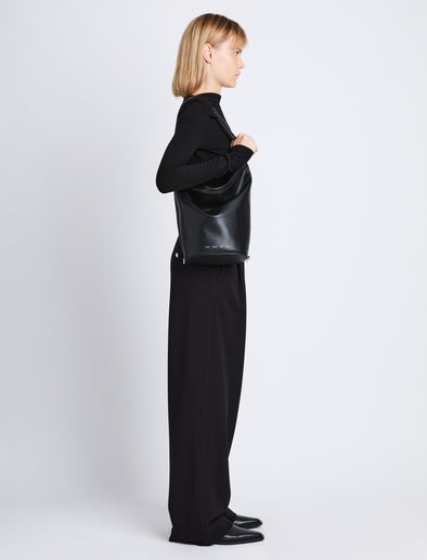 Image of model wearing image of Spring Bag In Leather in black on shoulder