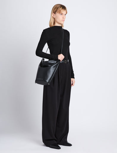 Image of model wearing image of Spring Bag In Leather in black as crossbody
