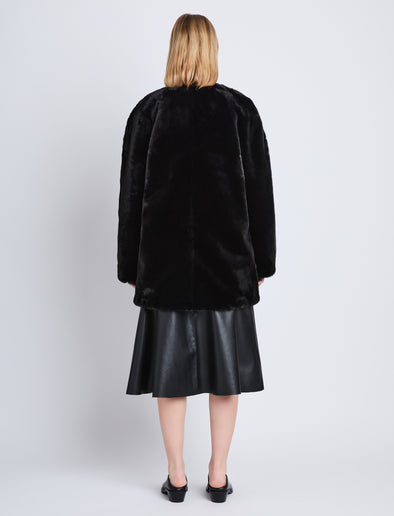 Back full length image of model wearing Penelope Coat in BLACK