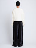 Back full length image of model wearing Tara Sweater in OFF WHITE
