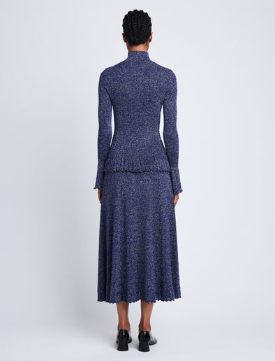 Back full length image of model wearing Avery Turtleneck in ROYAL BLUE/SILVER