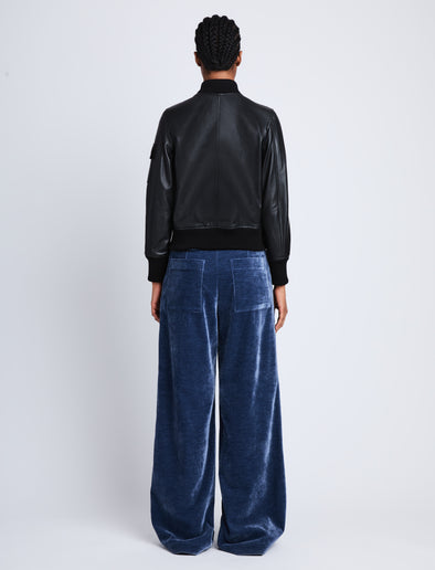 Back full length image of model wearing Mika Bomber Jacket in BLACK