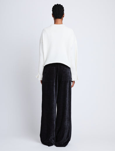 Back full length image of model wearing Aria Pant in BLACK