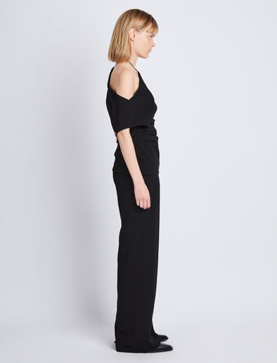 Side full length image of model wearing Francesa Off The Shoulder Top in BLACK