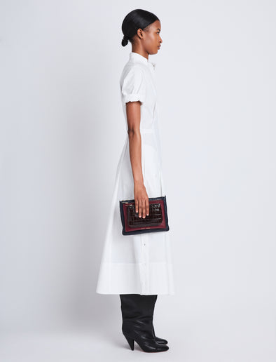 Image of model wearing Triple Zip Pouch in DEEP NAVY/GARNET/MOCHA