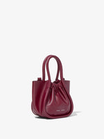 Side image of Extra Small Ruched Tote in GARNET