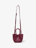 Front image of Extra Small Ruched Tote in GARNET with strap extended