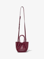 Front image of Extra Small Ruched Tote in GARNET with strap extended