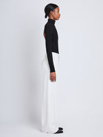 Side image of model wearing Weyes Pant In Matte Viscose Crepe in white