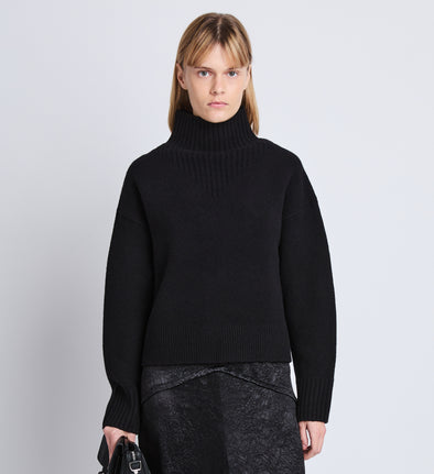 Cropped front image of model wearing Alma Sweater In Lofty Eco Cashmere in black