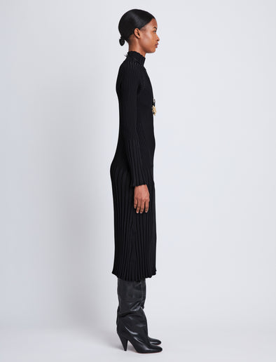 Side full length image of model wearing Midweight Viscose Rib Knit Dress in BLACK