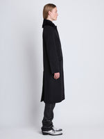 Side image of model wearing Louise Coat With Shearling Collar In Wool Cashmere in black