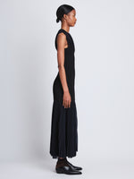 Side full length image of model wearing Niki Dress in NAVY