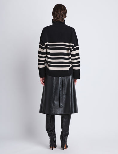 Back full length image of model wearing Sandra Turtleneck In Striped Doubleface Cashmere in BLACK MULTI