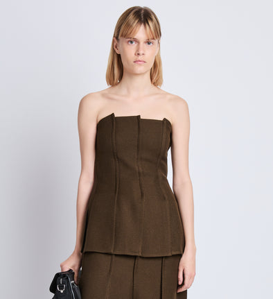 Front cropped image of model wearing Corinne Strapless Top in DARK LODEN