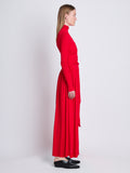 Side full length image of model wearing Meret Dress in RED