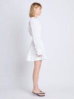 Side full length image of model wearing Eileen Dress in WHITE