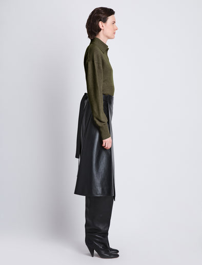 Side image of model wearing Jeanne Polo in FATIGUE