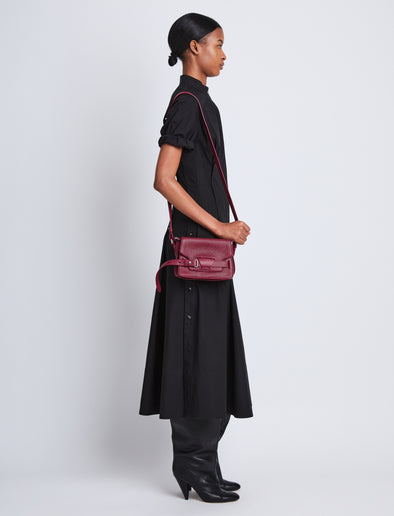 Image of model wearing Small Beacon Bag in GARNET