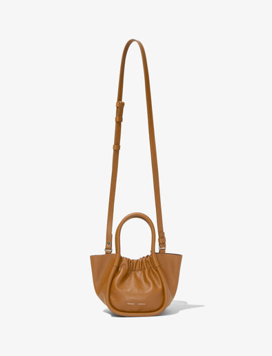 Front image of Extra Small Ruched Tote in COGNAC with strap extended