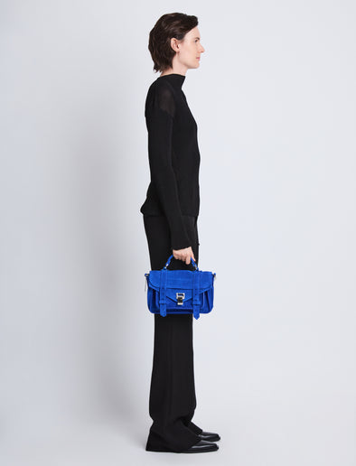 Image of model wearing Suede PS1 Tiny Bag in ELECTRIC BLUE