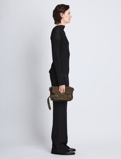 Image of model wearing Suede Beacon Saddle Bag in TEAK
