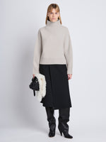 Front image of model wearing Lofty Eco Cashmere Turtleneck Sweater in LIGHT GREY MELANGE