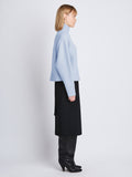 Side image of model wearing Alma Sweater In Lofty Eco Cashmere in pale blue